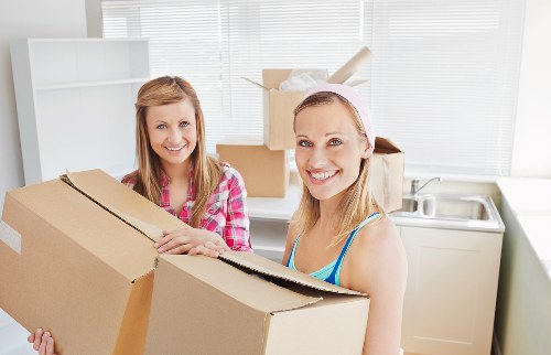 Loading furniture and boxes into a local removal van