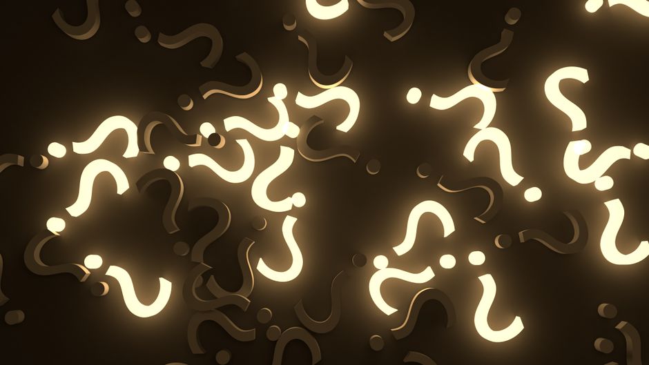 A collection of illuminated question marks in various sizes and orientations scattered across a dark background. The question marks are glowing with a soft light, creating a contrast against the dark backdrop. This visual suggests uncertainty or confusion, which aligns with themes of pricing or service inquiries related to house removals and moving services. Occasionally, pieces of packaging materials such as cardboard boxes and protective blankets are visible, indicating a moving or packing scenario. The scene appears to be indoors, possibly in a property setting, with the question marks symbolising common queries about relocation logistics. The image's lighting highlights the shapes while maintaining a neutral tone, fitting the context of professional moving services like those offered by Man with Van Sipson, seen in the domain link provided.